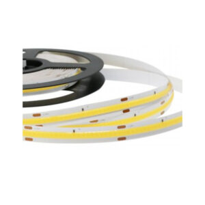A photo of a continuous yellow COB flexible LED strip light on a black dispensing reel showing the white 24V flexible PCB and copper cut points.