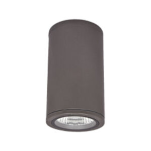A photo showing a dark grey Vega surface-mounted cylindrical LED downlight with a clear bottom glass lens and internal faceted reflector.